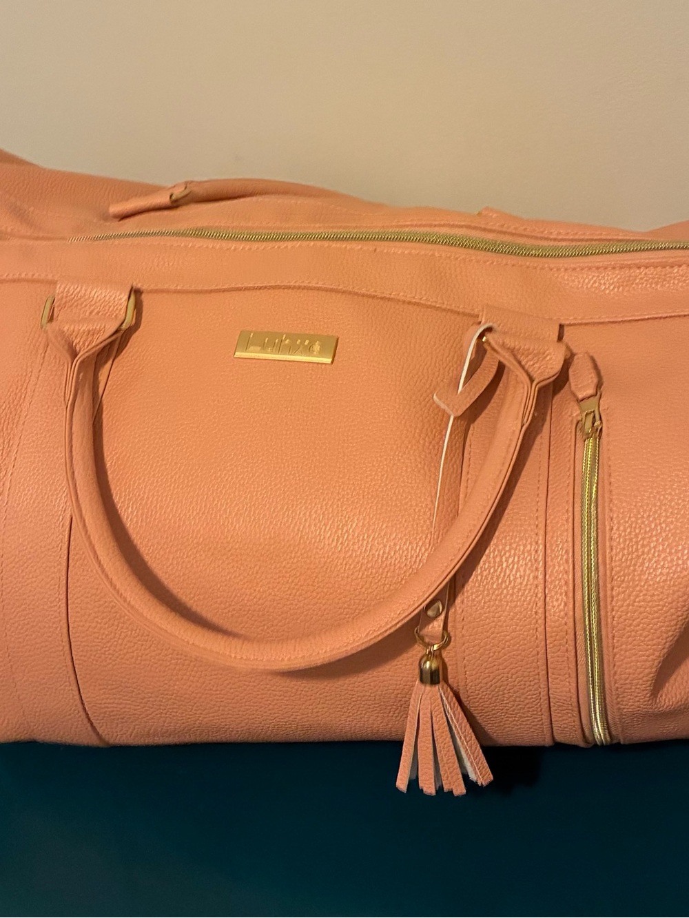 Peach Faux-Leather Travel Tote with Tassel and Gold Accents